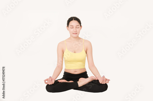 attractive beautiful woman play yoga in meditation pose on white background. healthy care concept.