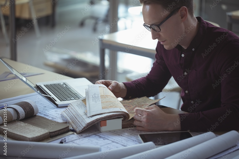 © Wavebreak Media - Architect looking at sample © Wavebreak Media - Architect looking at sample