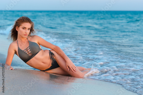 Happy carefree woman on the beach enjoying summer © fotofabrika