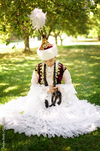 Beautiful kazakh woman in national costume photo