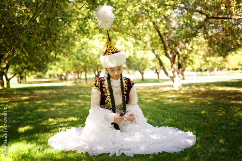 Beautiful kazakh woman in national costume photo