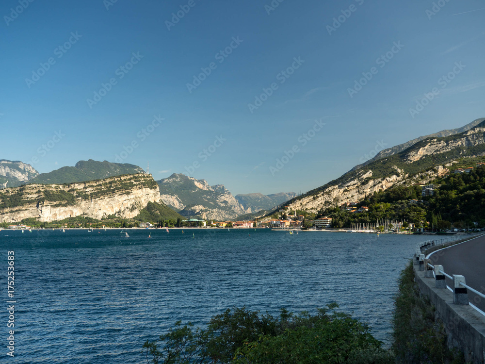 Beautiful peaceful lake Garda, Italy. Autumn, blue sky and bright sun.