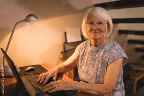 Senior woman working on laptop