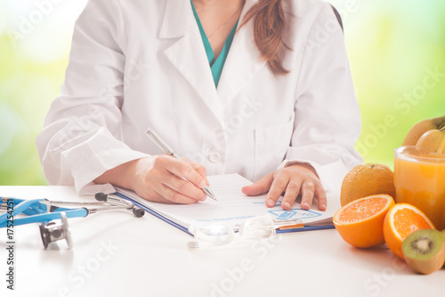 Doctors Hands Writing Diet. Diet nutrition concept
