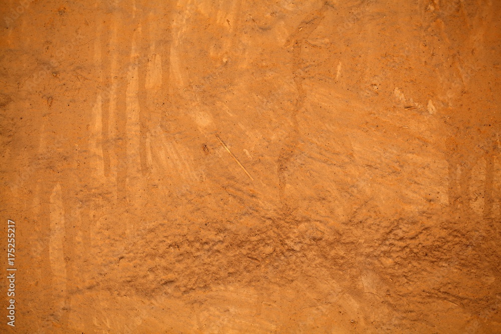 Naklejka premium Brown clay mortar on a wall