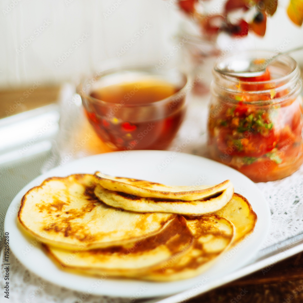 Romantic Breakfast by the window - pancakes and tea Romantic Breakfast by the window - pancakes and tea