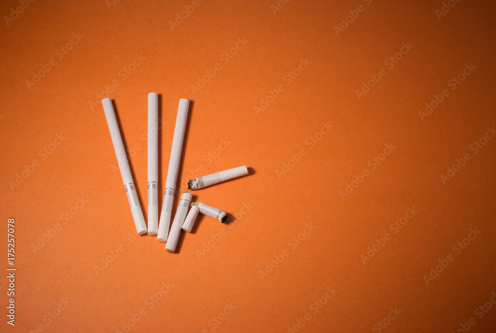 A top view image of several commercially made cigarettes. A top view image of several commercially made cigarettes.