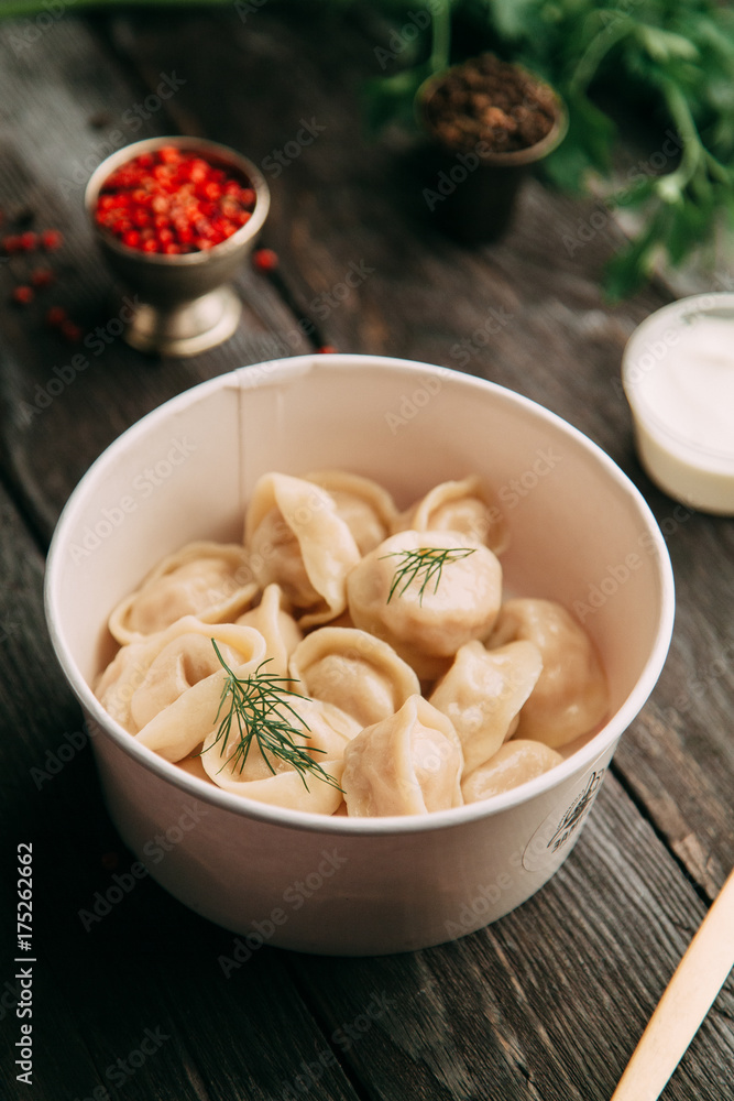 dumplings with potatoes, cheese, berries, compositions for the menu of the restaurant, decorated with greens and sauce dumplings with potatoes, cheese, berries, compositions for the menu of the restaurant, decorated with greens and sauce