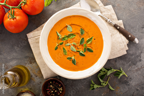 Fotografie Tomato soup with olive oil and herbs