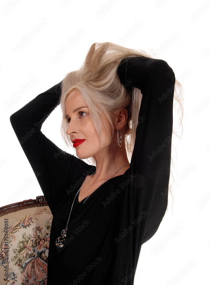 Blond woman messing her hair Blond woman messing her hair
