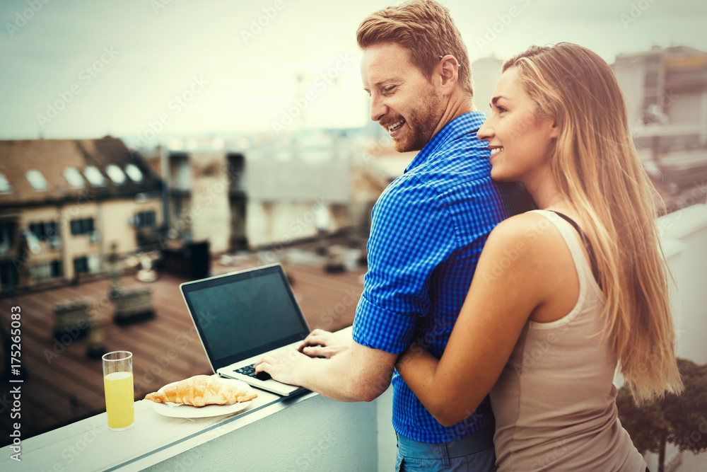 Couple hugging outdoors in top of building Couple hugging outdoors in top of building