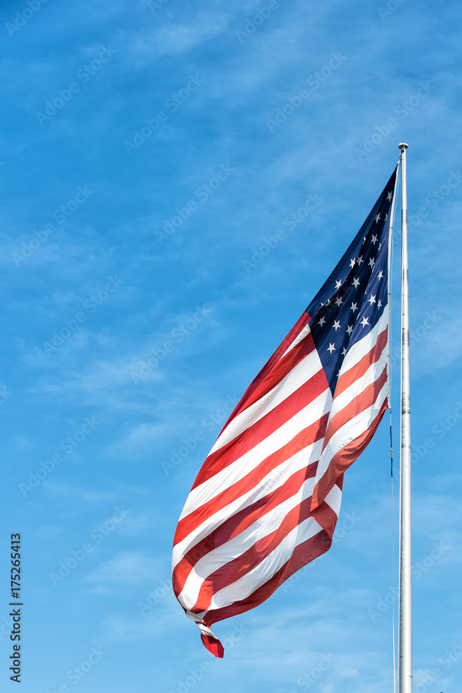 American flag on the blue sky in Key West, USA American flag on the blue sky in Key West, USA