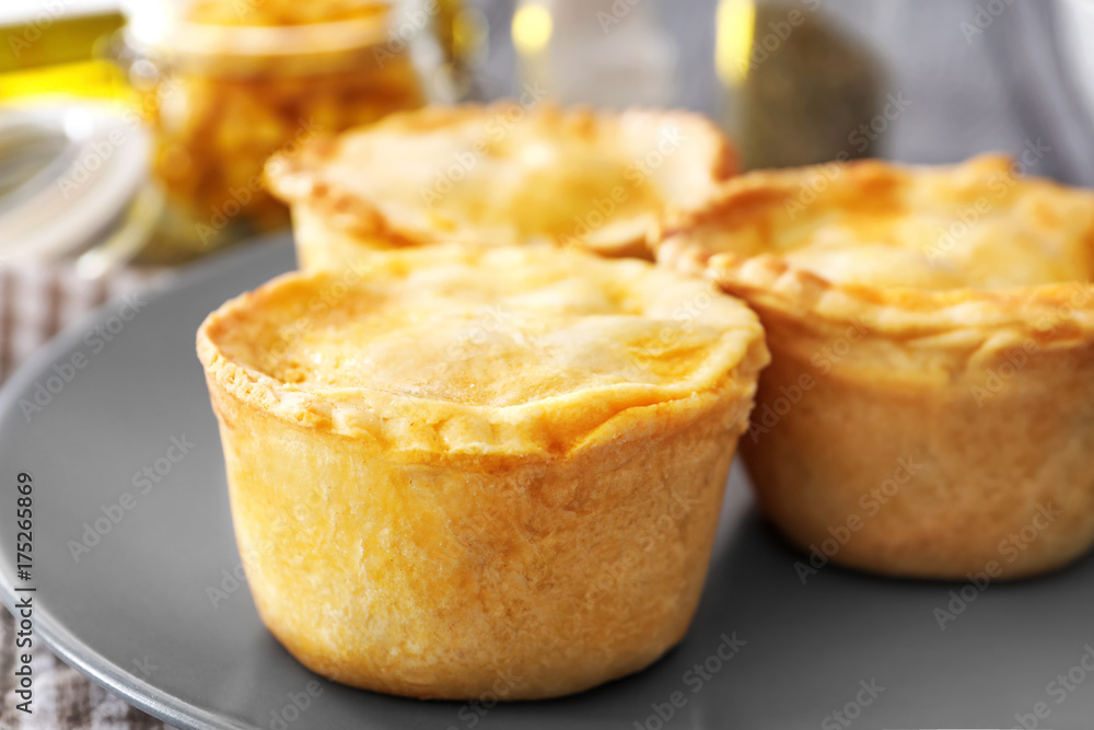 Delicious meat mini pies on plate, closeup Delicious meat mini pies on plate, closeup