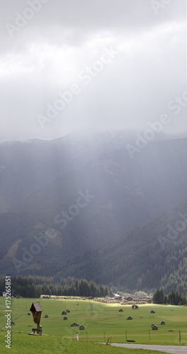 sunbeam coming out from the clouds photo