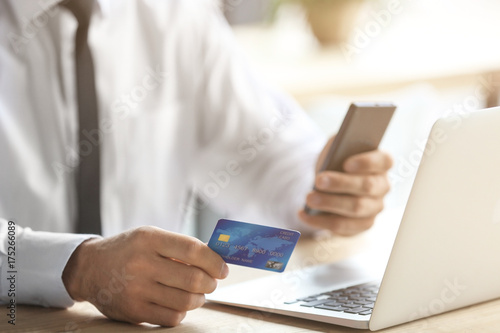 Businessman holding credit ...