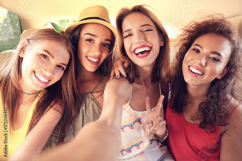 Beautiful young women takin...