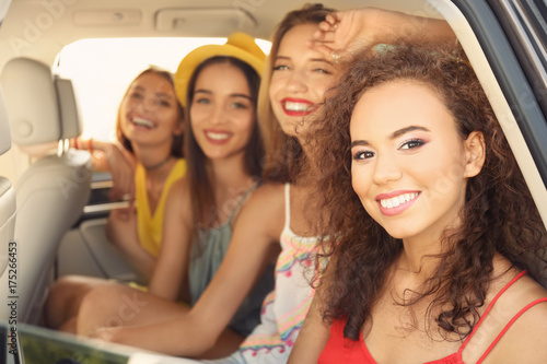 Beautiful young women in car