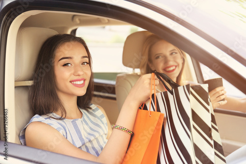 Beautiful young women in car