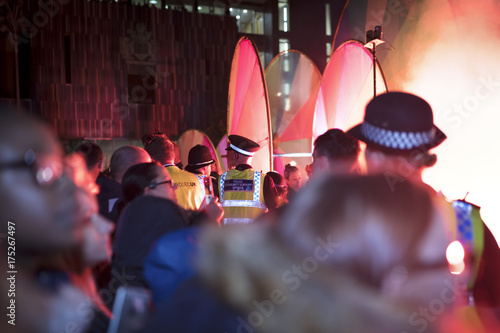 Police monitor a crowd at a festival in the UK