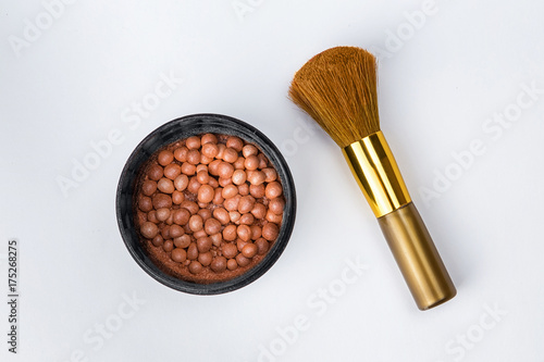 cosmetics, blush, blush in a jar with a brush on a white background