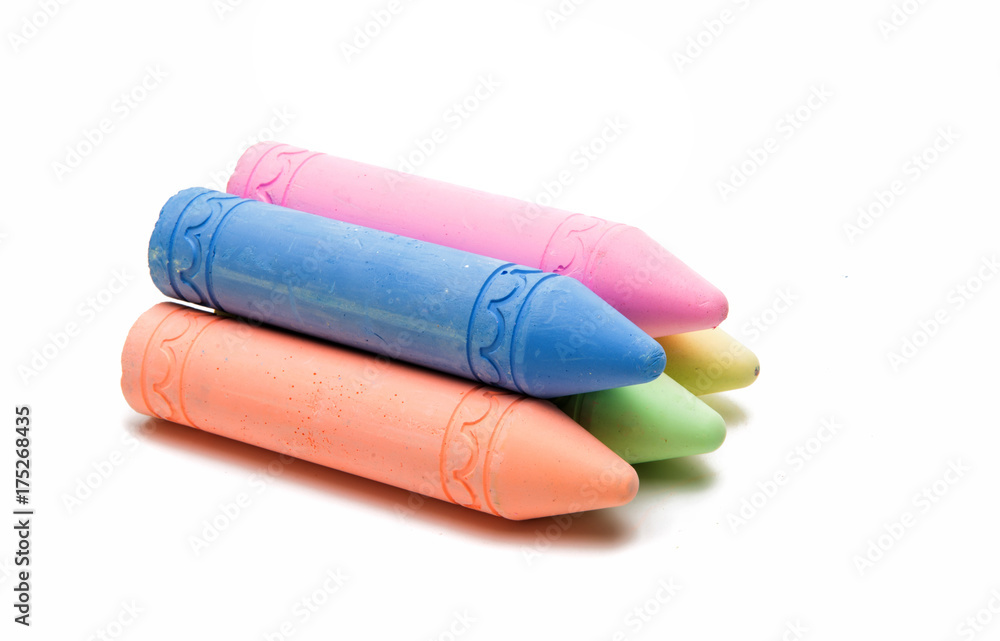 Sticks of pastel colored chalk casting shadow Sticks of pastel colored chalk casting shadow