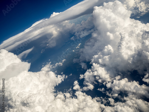 Photography Large, Puffy Clouds from Above, Tilted Angle
