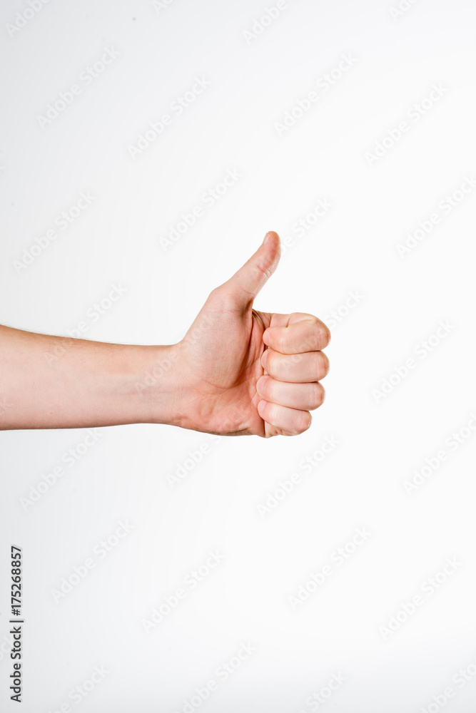 Male hand showing thumbs up sign