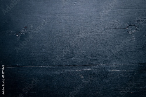 Black wooden background. Top view. Free space for text.
