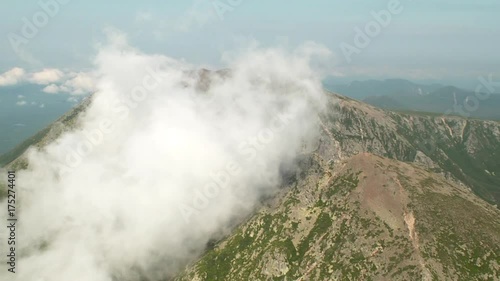 Aerial, fluffy clouds over Mount Katahdin