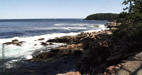 Maine, waves crash on rocky coastline
