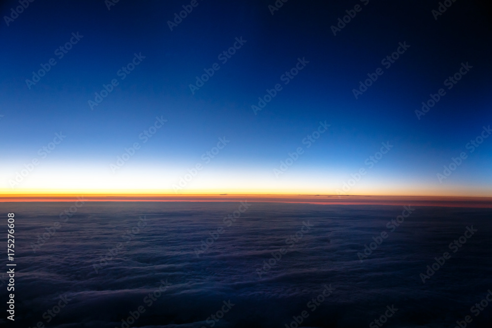 Sunset from the airplane, wing, clouds, sky.