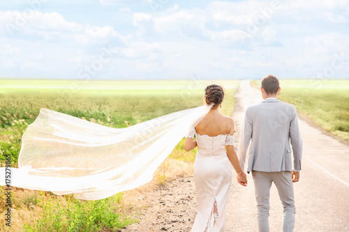 Happy beautiful couple on w...