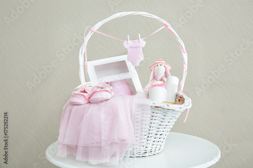 Wicker basket with baby sho...