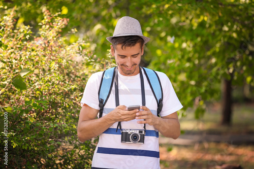 Young man with phone and ca...