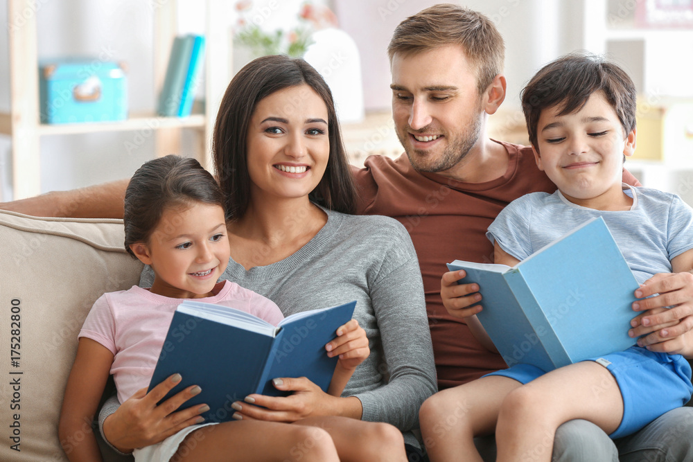 Happy family reading books at home Happy family reading books at home