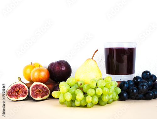 Fototapeta Naklejka Na Ścianę i Meble -  Grape juice with autumn seasonal fruits.