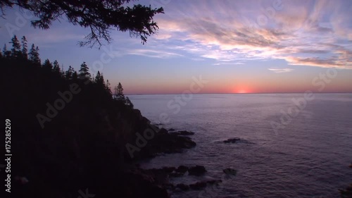 Scenic sunrise over rocky coast in Acadia National Park, wide