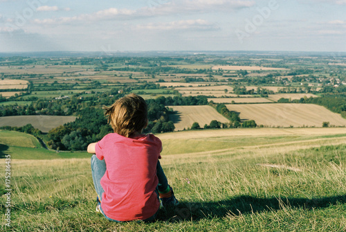 Rear view of boy enjoying view in Oxfordshire photo