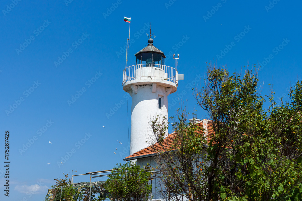 Lighthouse against the blue sky. The Island of St. Anastasia. Burgas Bay. Black Sea. Bulgaria. Lighthouse against the blue sky. The Island of St. Anastasia. Burgas Bay. Black Sea. Bulgaria.