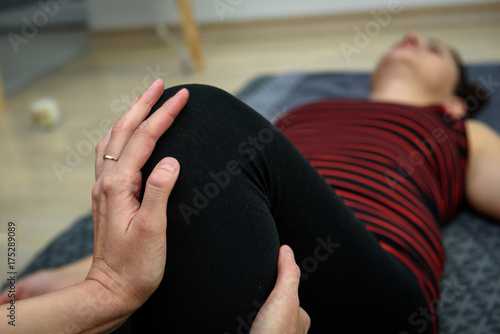 Young female masseur perform Thai massage to young woman © Toshe