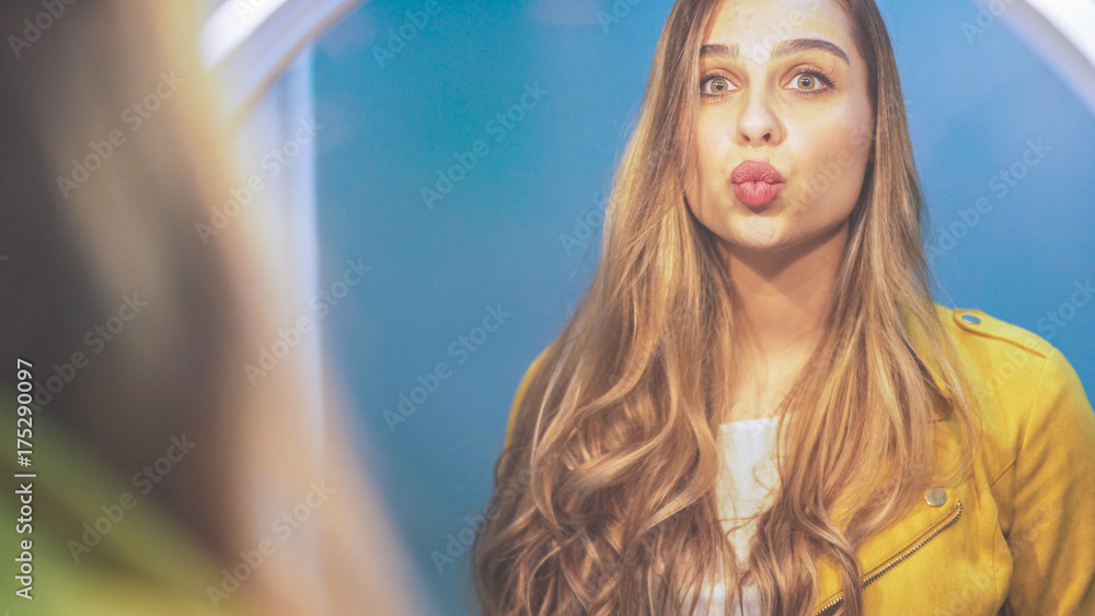 Beautiful woman in front of the mirror make up herself Beautiful woman in front of the mirror make up herself