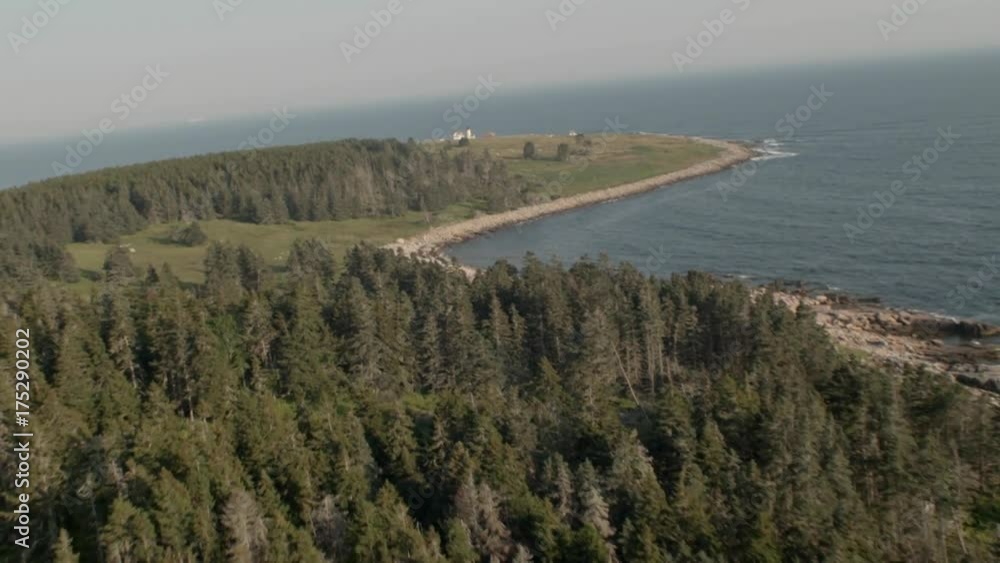 Waves crash on shore near lighthouse in Acadia National Park, aerial Waves crash on shore near lighthouse in Acadia National Park, aerial