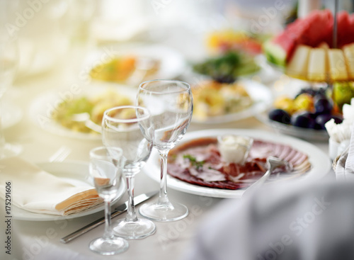 Beautiful table set with three glasses for a party, wedding reception or festive event