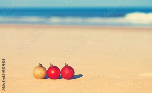 Christmas ornaments in the sand on a tropical beach