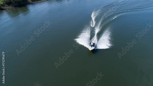 Aerial shooting wake surfing on the river
