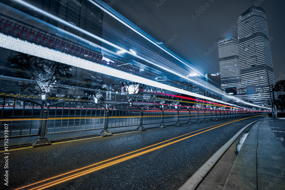 light trails in the downtown district of shanghai, china.
