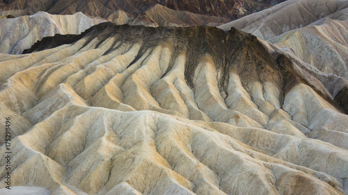 Layers of sediment from ancient lakes color the erosional landscape near Zabriskie Point in Death Valley National Park.