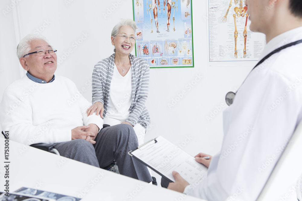 A young doctor and an elderly patient are talking A young doctor and an elderly patient are talking