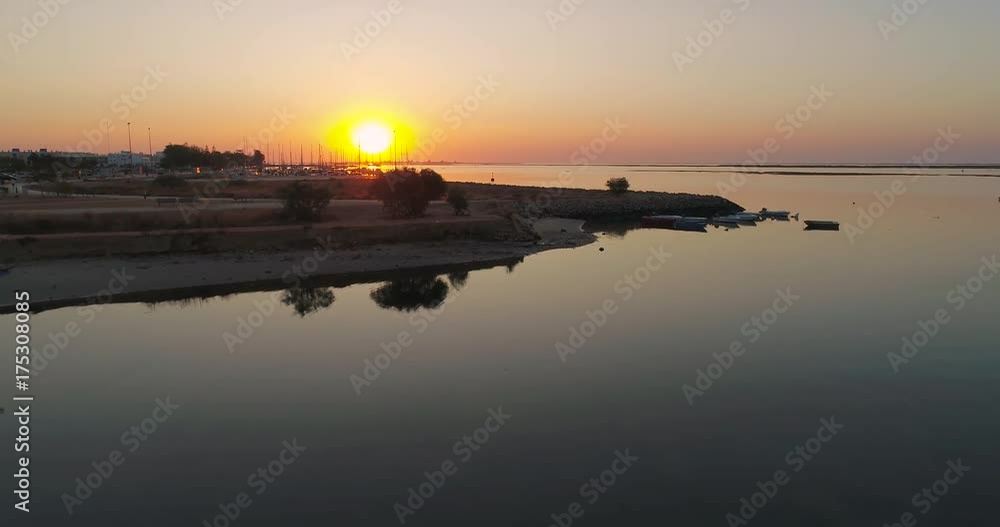 Sunrise aerial seascape view of Olhao salt marsh Inlet, waterfront to Ria Formosa natural park. Algarve. Sunrise aerial seascape view of Olhao salt marsh Inlet, waterfront to Ria Formosa natural park. Algarve.