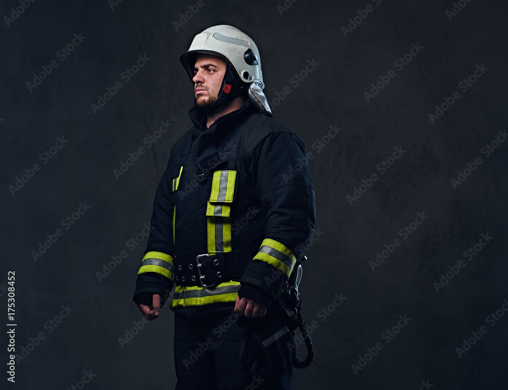 Fototapeta premium Studio portrait of firefighter dressed in uniform.